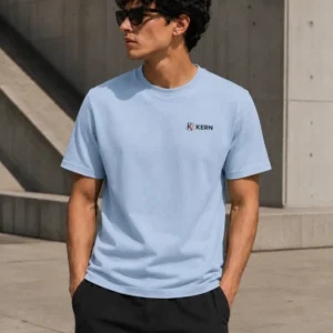 Male model wearing the KERN Essentials light blue T-shirt with small chest logo